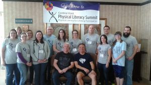 Central East Physical Literacy Summit-group in front of banner